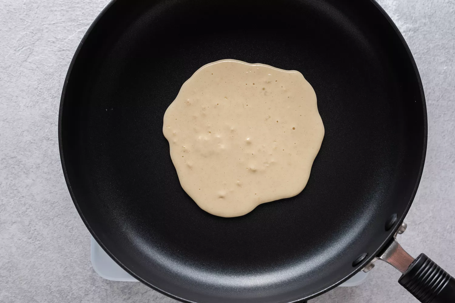 Pancake batter in a skillet